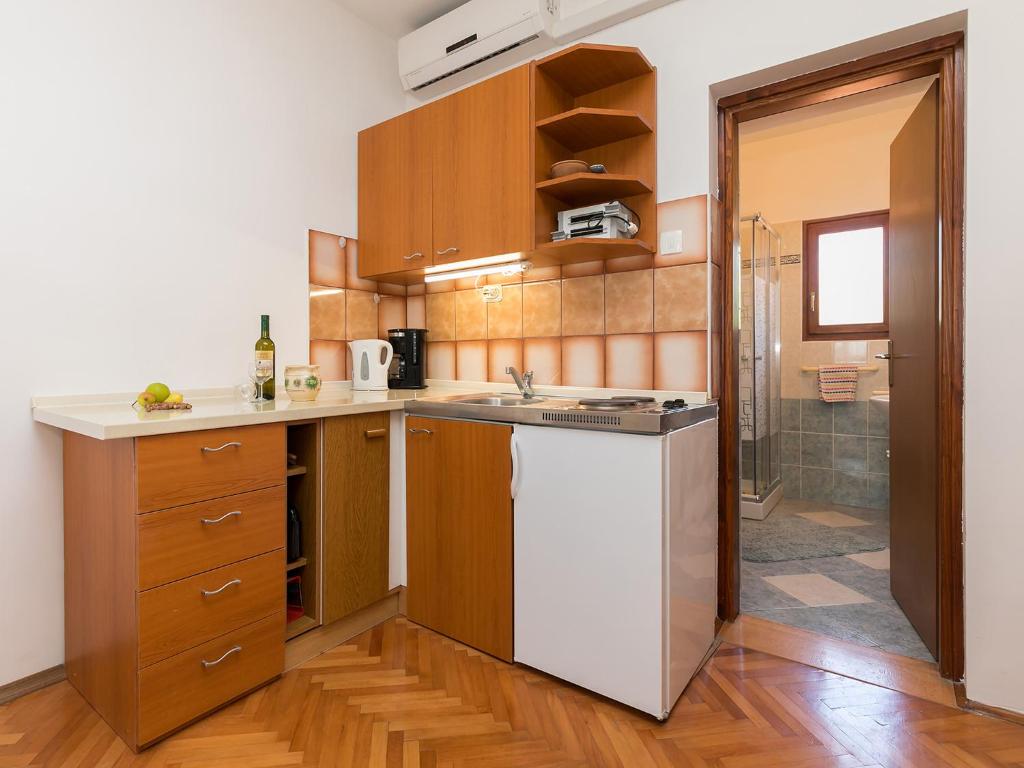 Kuchyň nebo kuchyňský kout v ubytování Apartman Šušnjić