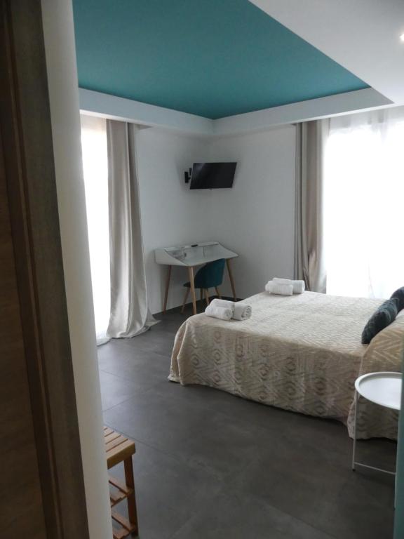 Postel nebo postele na pokoji v ubytování Albergo Piazza Risorgimento