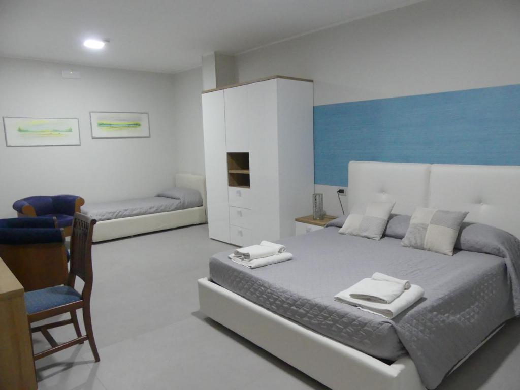 Postel nebo postele na pokoji v ubytování Albergo Piazza Risorgimento