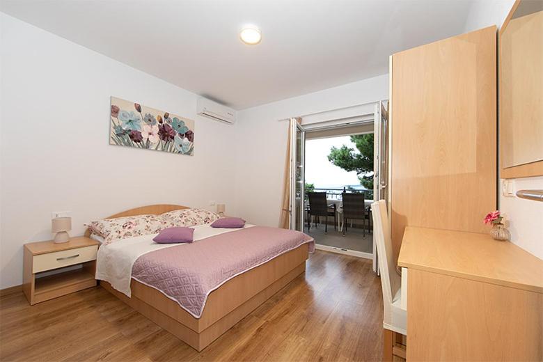 Posteľ alebo postele v izbe v ubytovaní Apartmani Vice