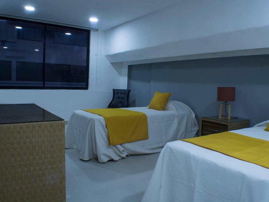 Postel nebo postele na pokoji v ubytování Malecon Cozy - Premium Plus 21