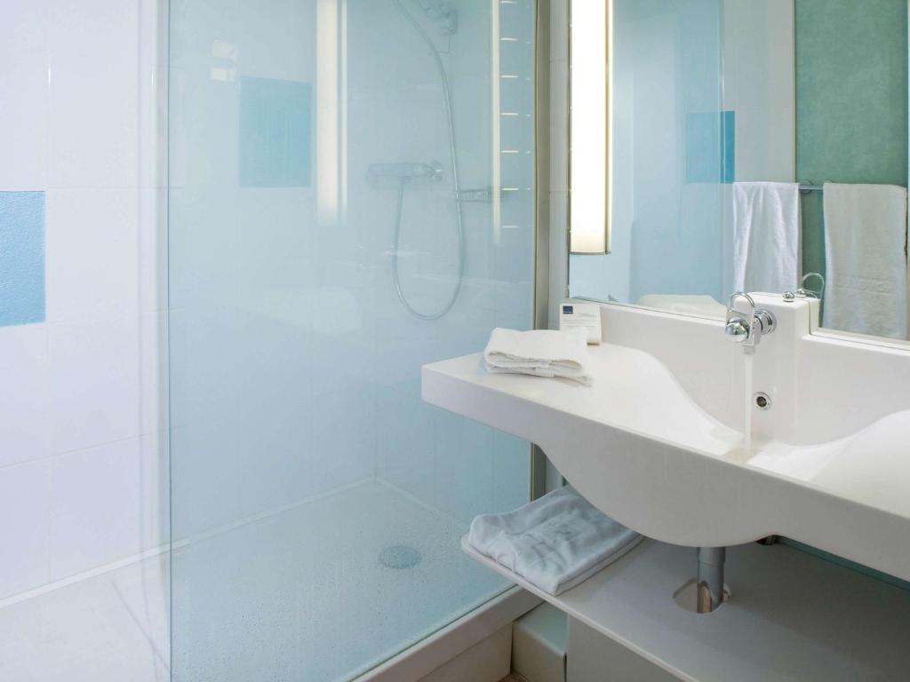 Koupelna v ubytování Novotel Clermont-Ferrand