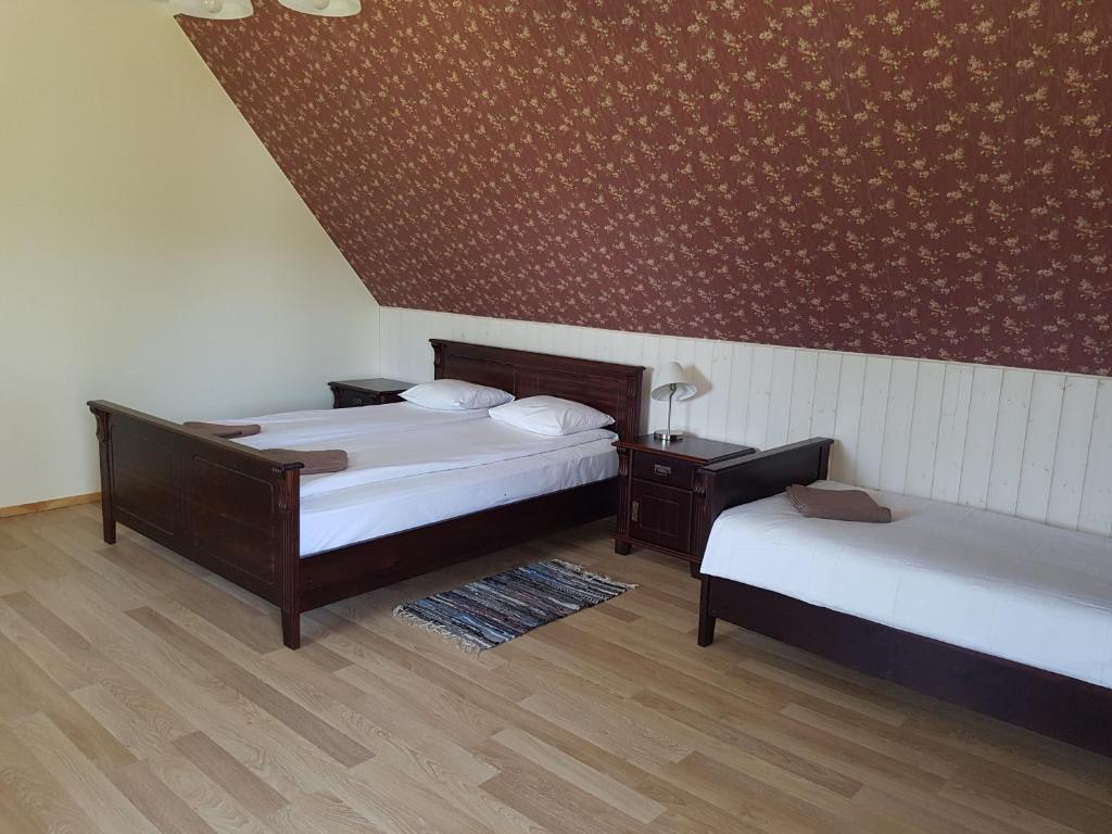 Postel nebo postele na pokoji v ubytování Risti kodumajutus