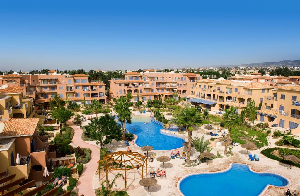 an aerial view of a resort with two pools at Resitour - Limnaria Gardens in Paphos City