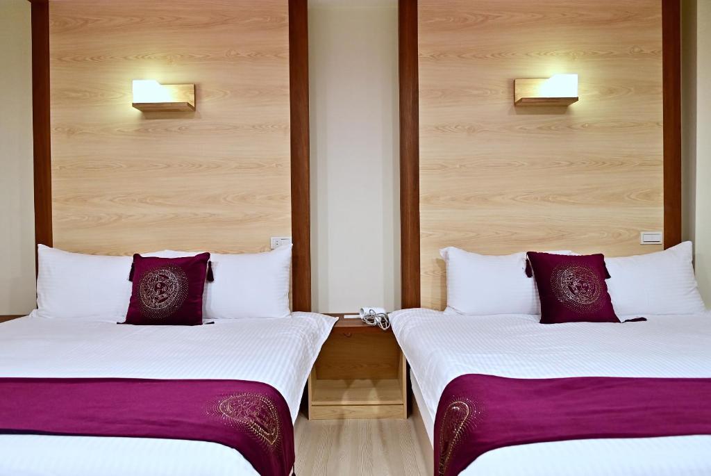 Postel nebo postele na pokoji v ubytování Hotel Yong Cheng