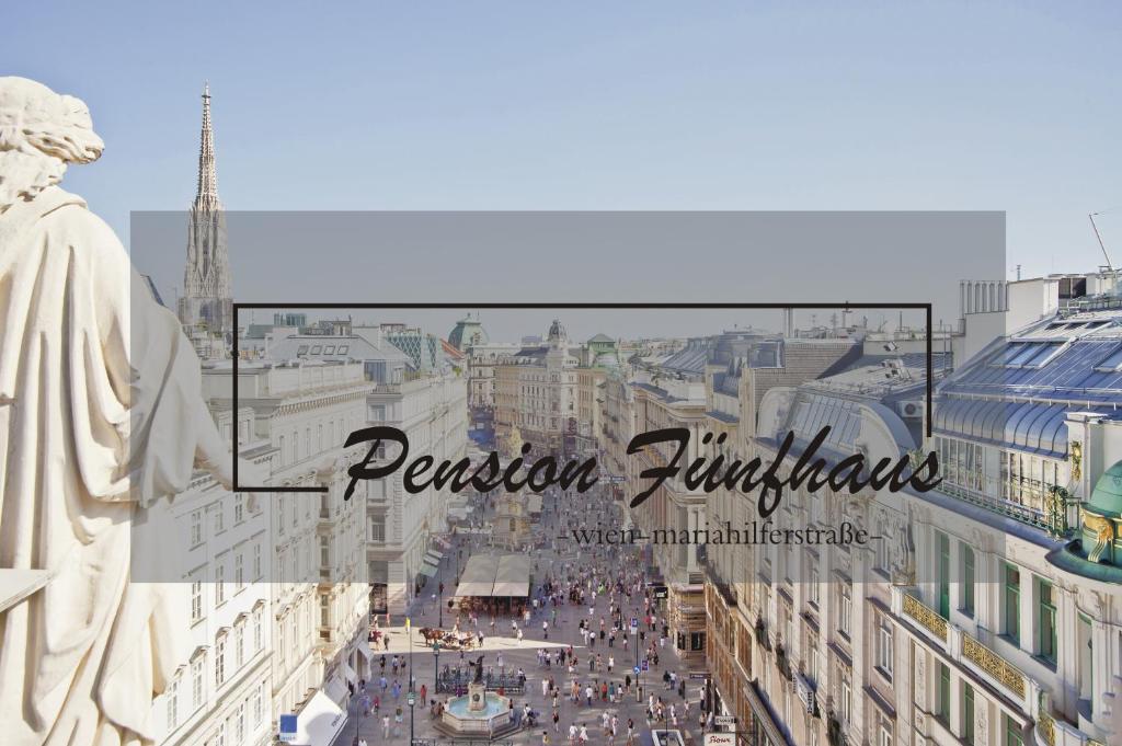 a view of a city with a statue and buildings at Pension Fünfhaus in Vienna