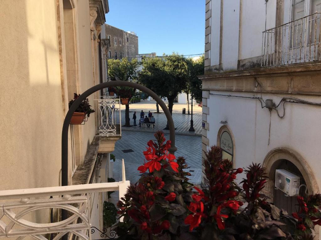 a balcony with a christmas tree on a building at B&B San Martino in Martina Franca