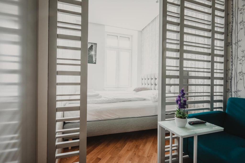 Łóżko lub łóżka w pokoju w obiekcie ZEUS Design Apartments Wasserwelt