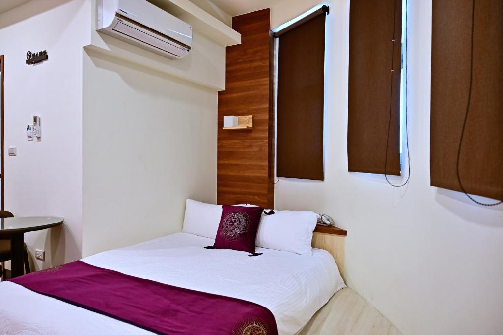 Postel nebo postele na pokoji v ubytování Hotel Yong Cheng