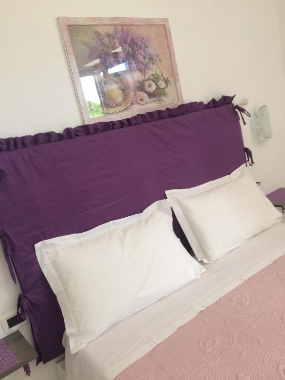 Postel nebo postele na pokoji v ubytování Casa Violet per Civita