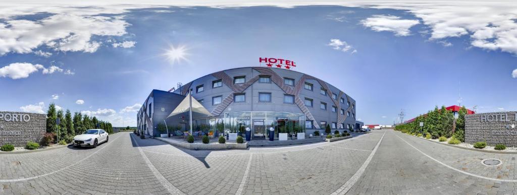 uma representação de um hotel com um edifício em Hotel Porto em Radomsko