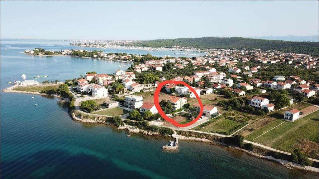 an aerial view of an island with a red circle on it at Apartman Barbir in Sukošan