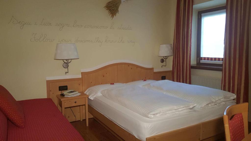Postel nebo postele na pokoji v ubytování Hotel del Bosco