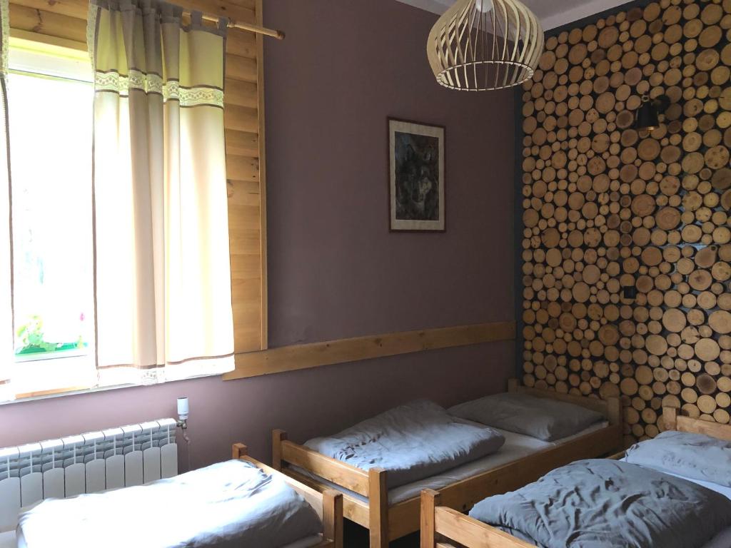 Posteľ alebo postele v izbe v ubytovaní Latarnia Wagabundy Bieszczady