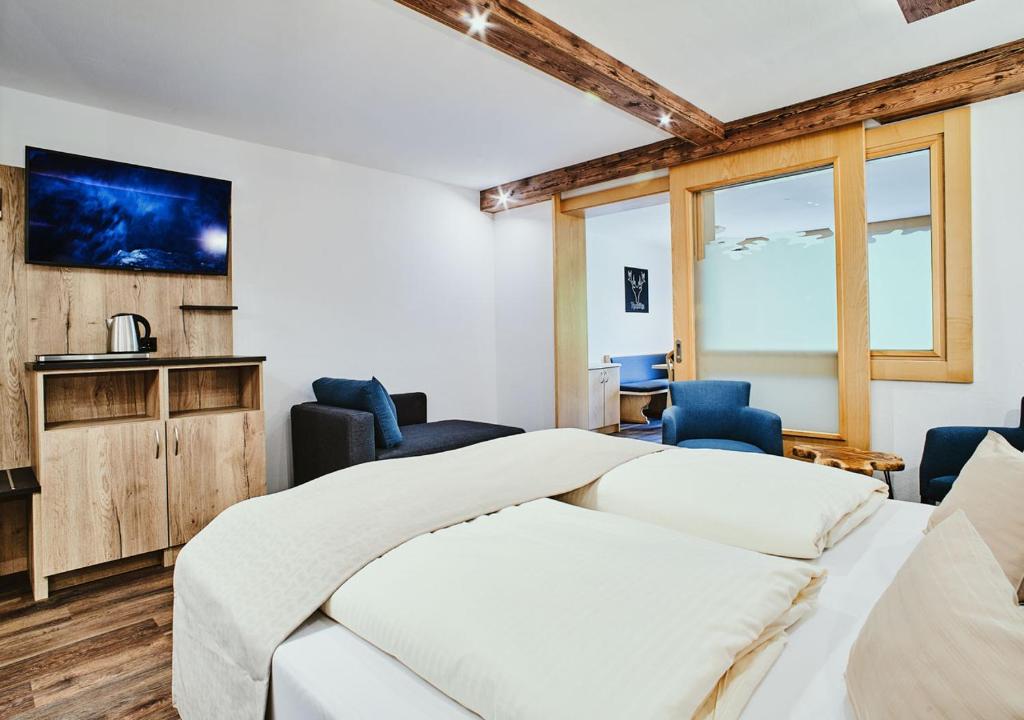 Postel nebo postele na pokoji v ubytování Hotel Rustika