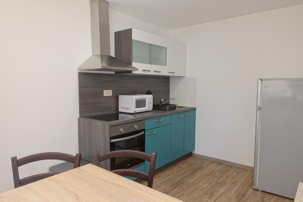 Kuchyň nebo kuchyňský kout v ubytování Apartments Laura FARM STAY
