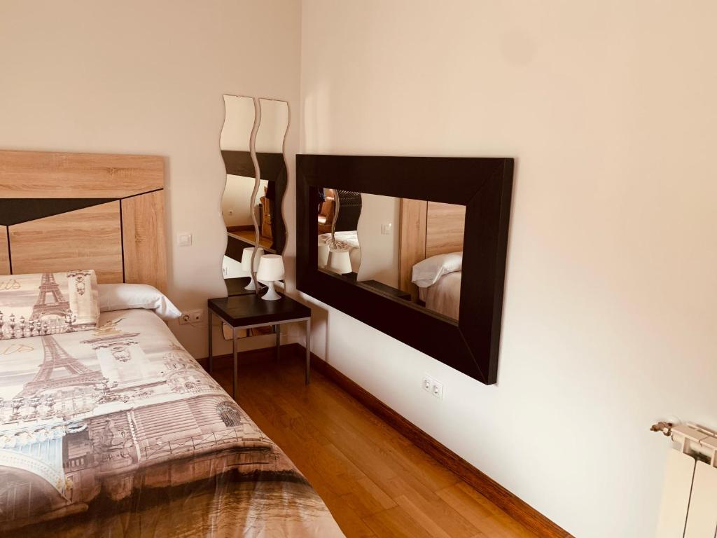 A bed or beds in a room at Estudios Blanmart