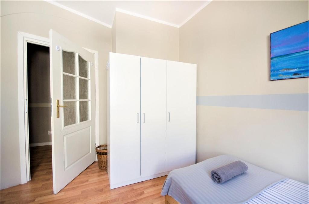Posteľ alebo postele v izbe v ubytovaní Apartament Batory