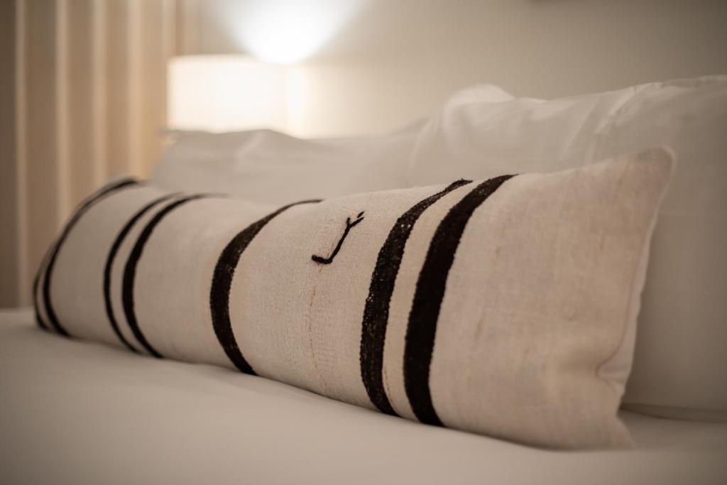 a pillow sitting on top of a bed at The Pearl Hotel in San Diego