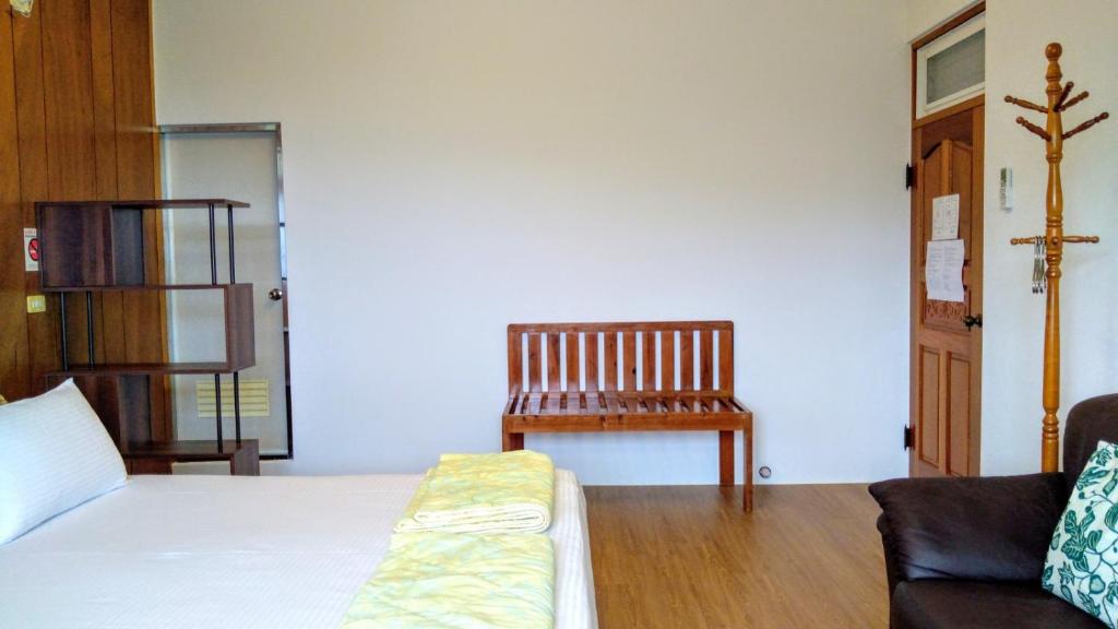 Postel nebo postele na pokoji v ubytování 樸宿庭園民宿 南投民宿312號