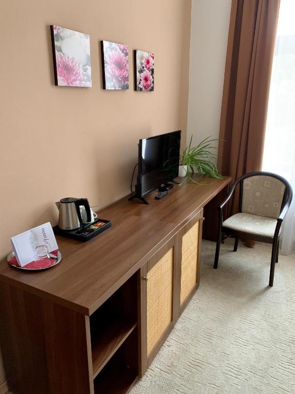 TV i/ili multimedijalni sistem u objektu Hotel Art