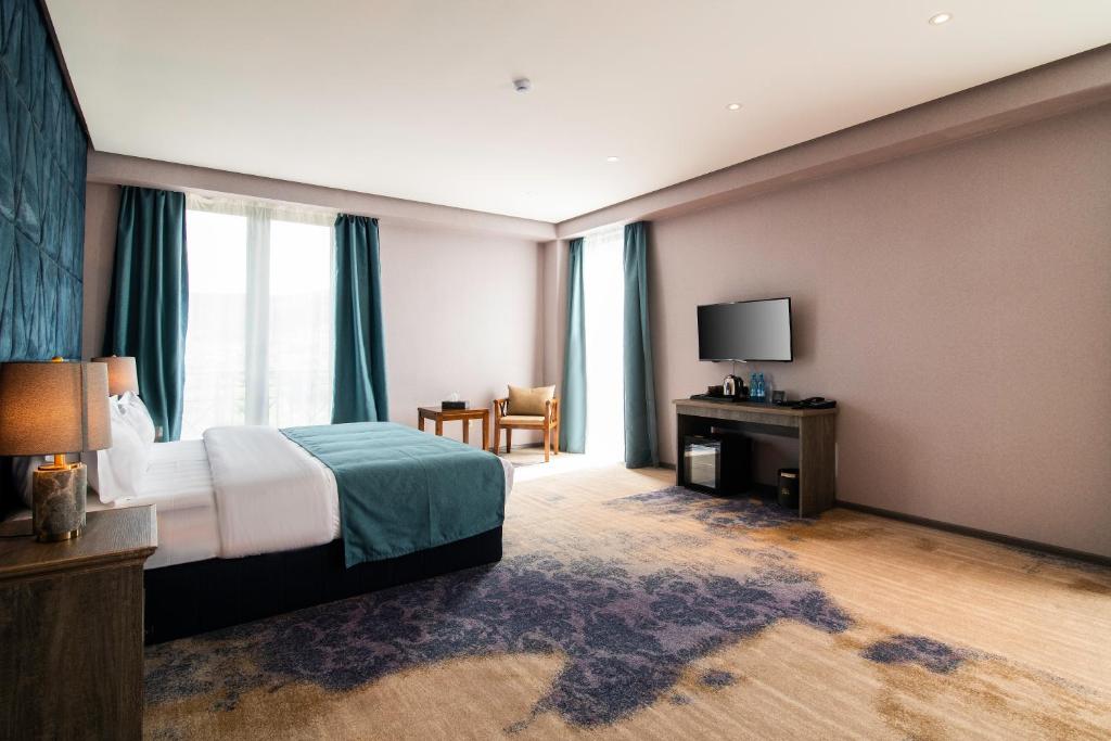 Postel nebo postele na pokoji v ubytování Aurora Resort, Tsaghkadzor