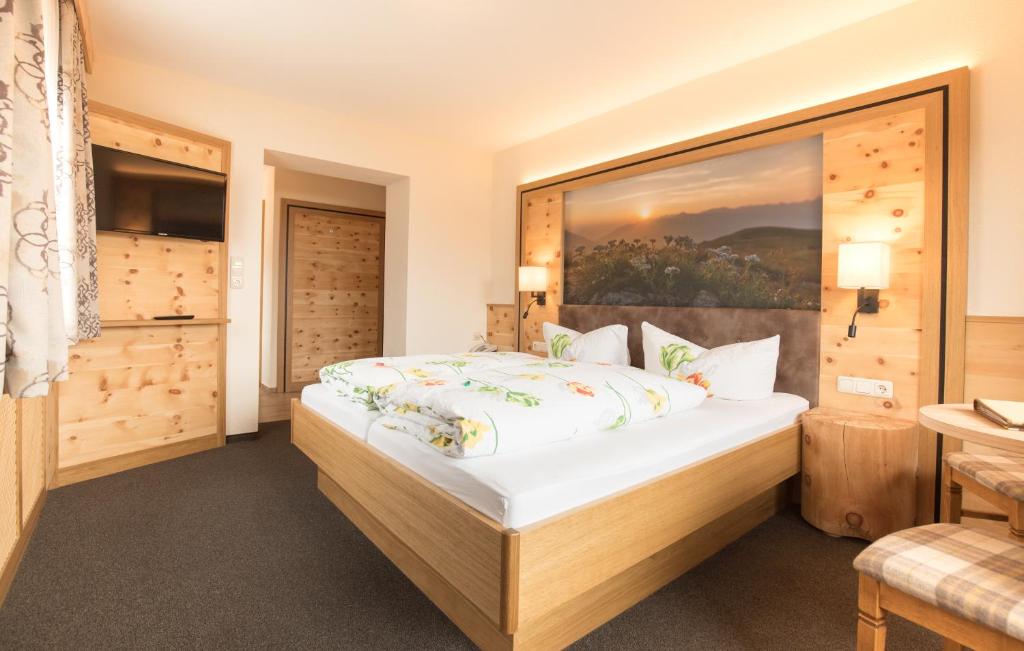 Postel nebo postele na pokoji v ubytování Hotel Garni Sonnenheim