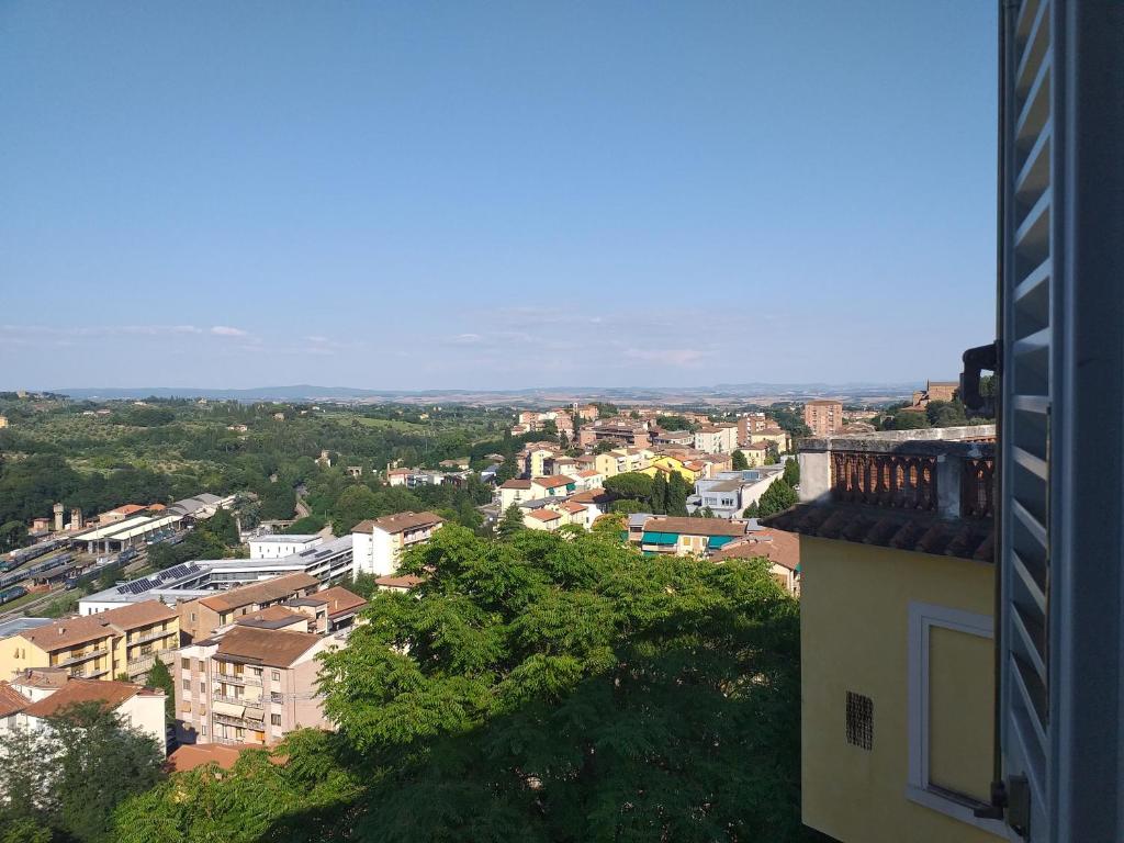 a view of a city from a building at Casa di Alfredo Affittacamere in Siena