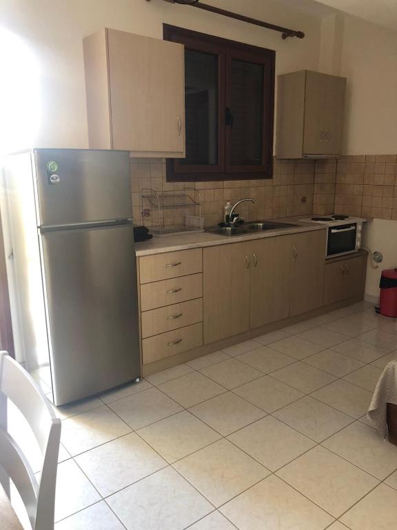 Kuchyň nebo kuchyňský kout v ubytování Savvas Apartments
