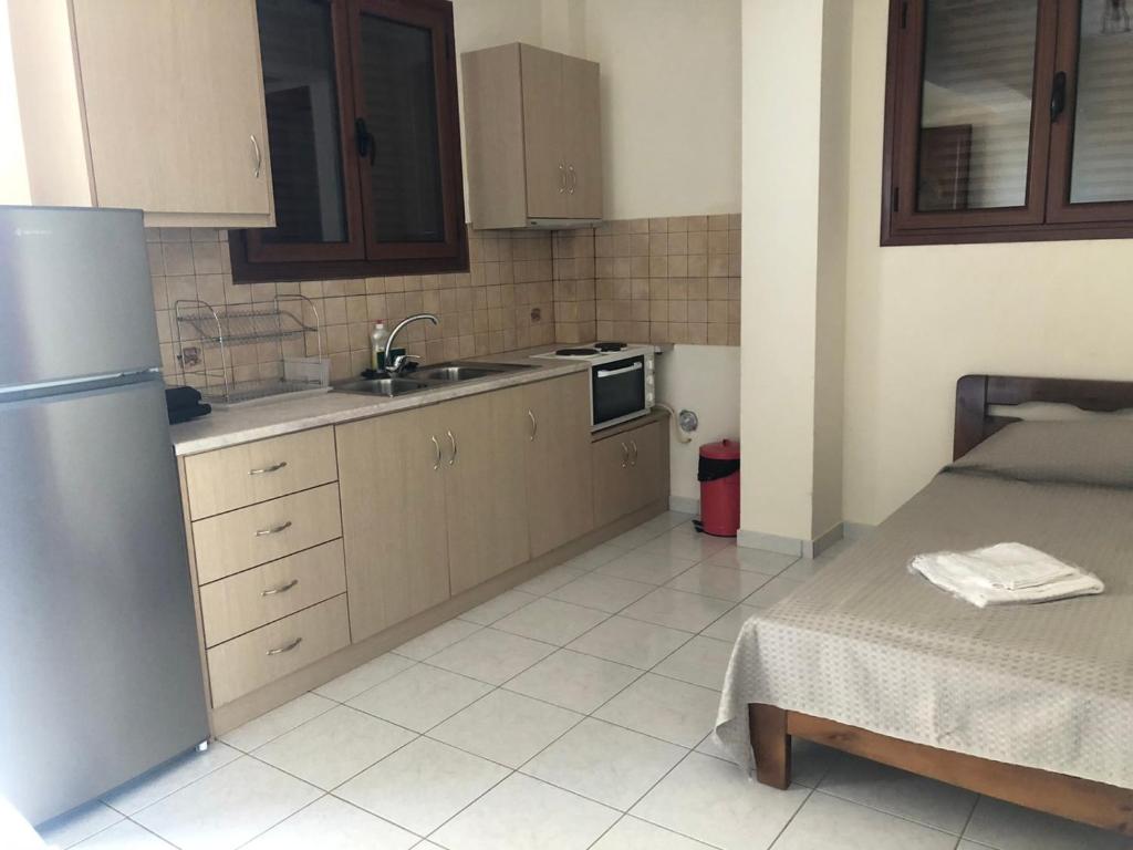 Kuchyň nebo kuchyňský kout v ubytování Savvas Apartments