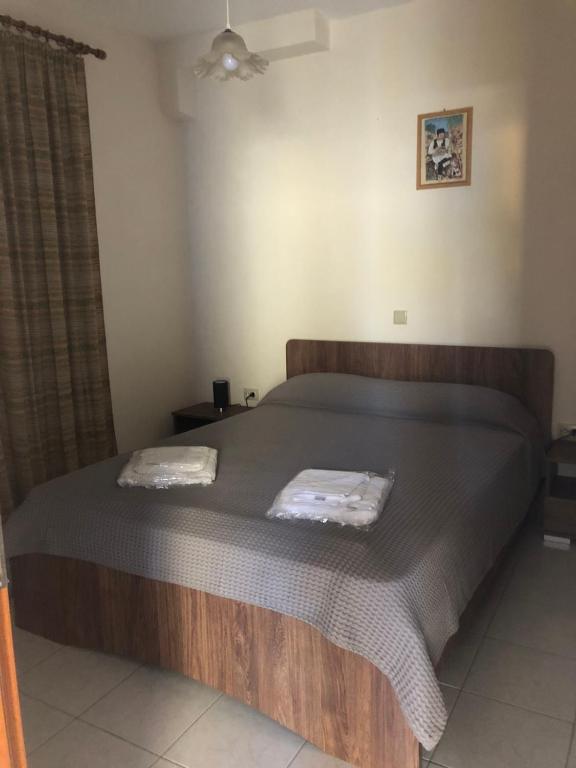 Postel nebo postele na pokoji v ubytování Savvas Apartments