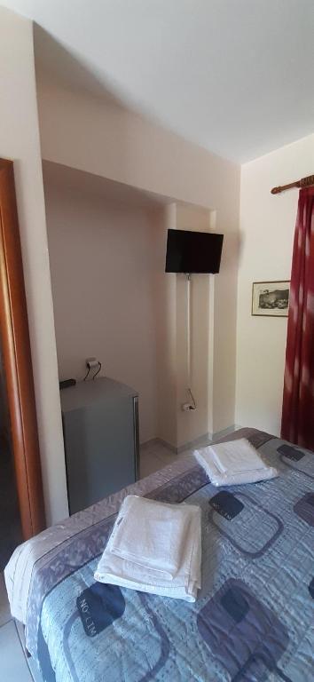 Postel nebo postele na pokoji v ubytování Savvas Apartments