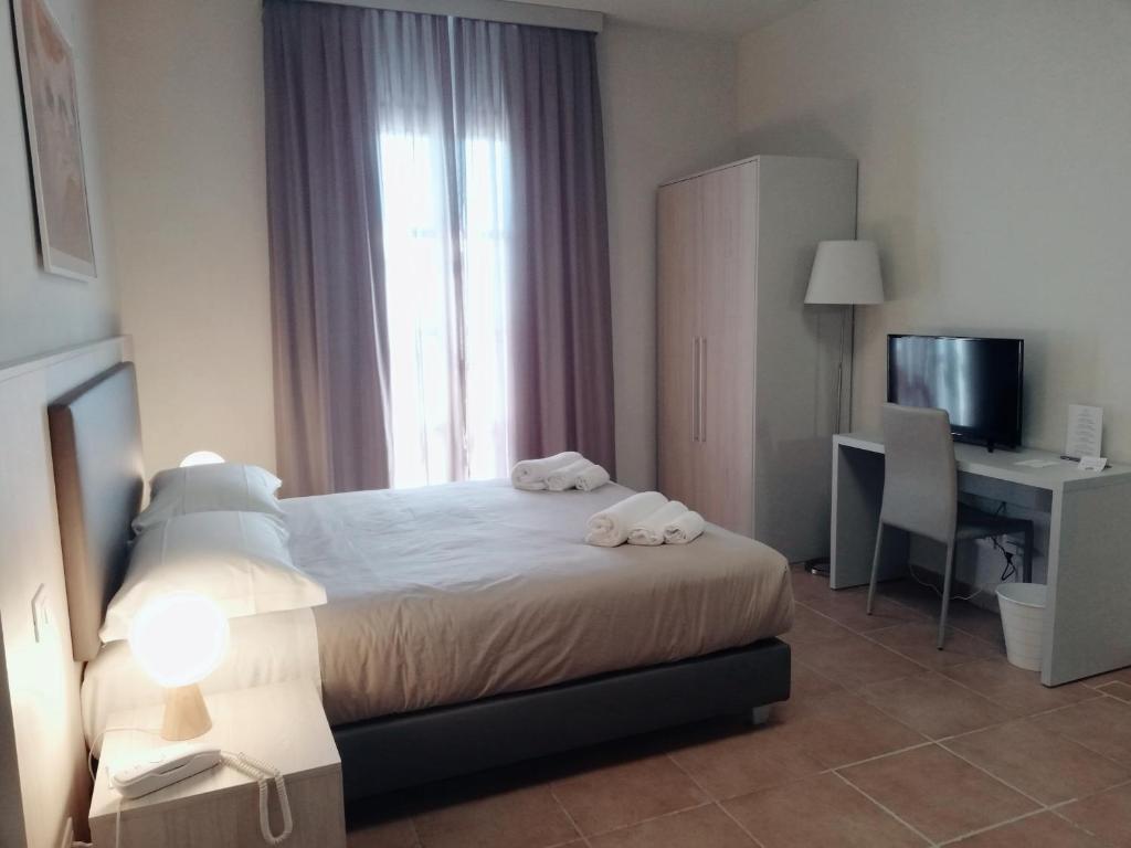 A bed or beds in a room at Villa Nadar
