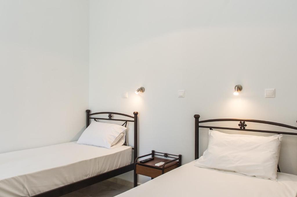 Postel nebo postele na pokoji v ubytování Tasos Rooms