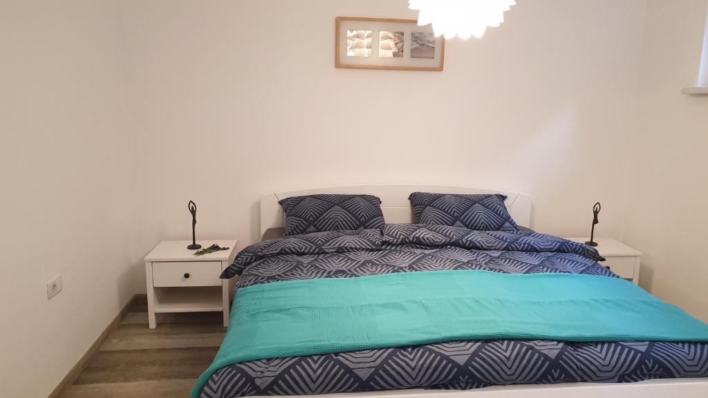 Postel nebo postele na pokoji v ubytování Apartma Claudia