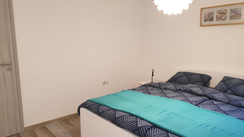 Postel nebo postele na pokoji v ubytování Apartma Claudia