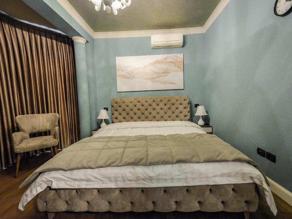 Postel nebo postele na pokoji v ubytování Hotel Vila Tirana