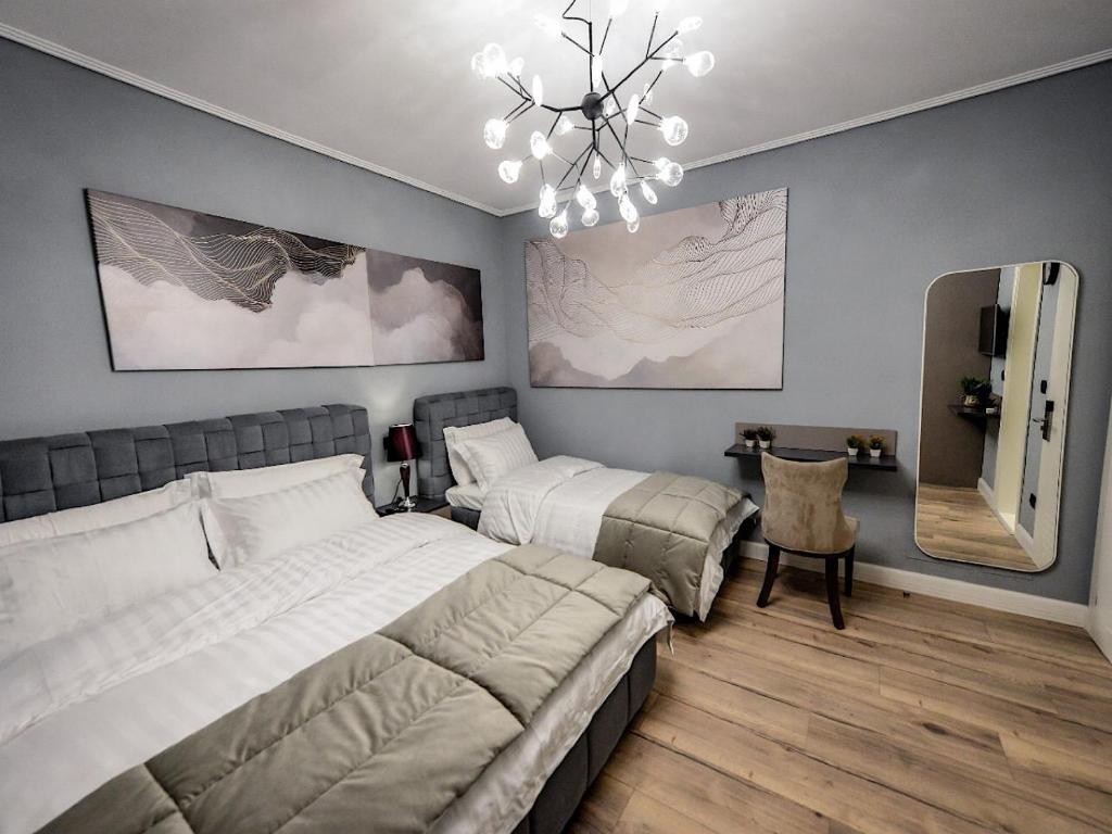 Postel nebo postele na pokoji v ubytování Hotel Vila Tirana