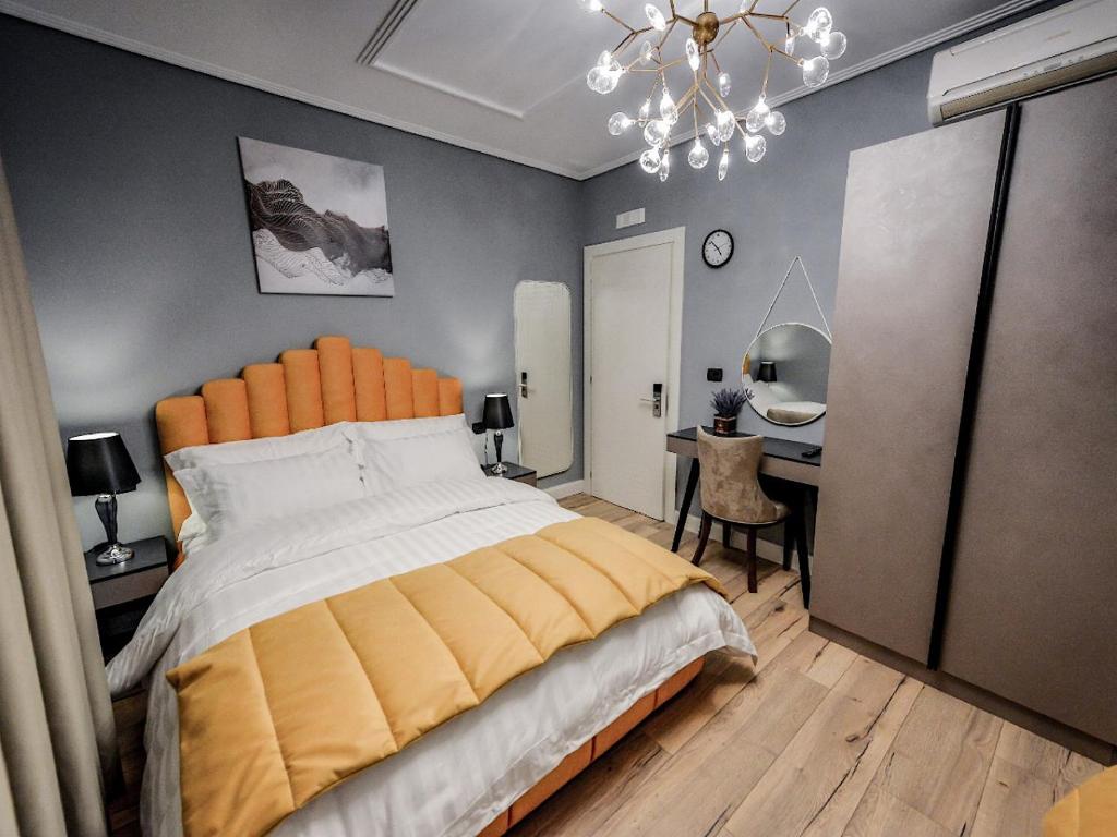 Postel nebo postele na pokoji v ubytování Hotel Vila Tirana