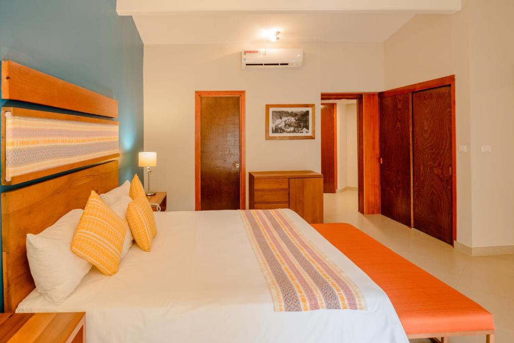 Postel nebo postele na pokoji v ubytování Hotel Loma Real