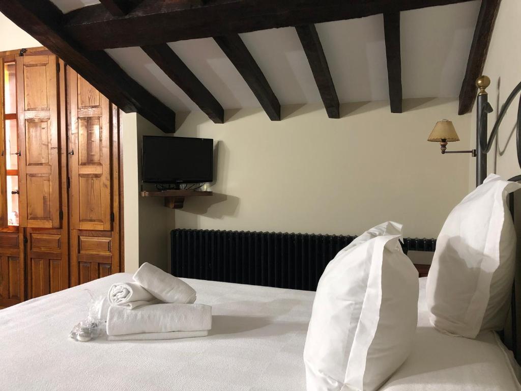 Postel nebo postele na pokoji v ubytování Posada La Cuadrona