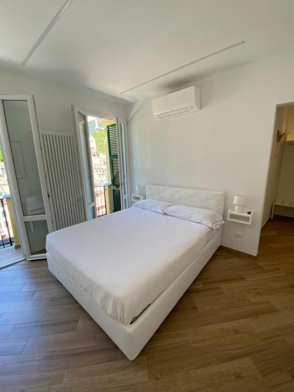 Postel nebo postele na pokoji v ubytování Affittacamere Benedetta e Isabelle