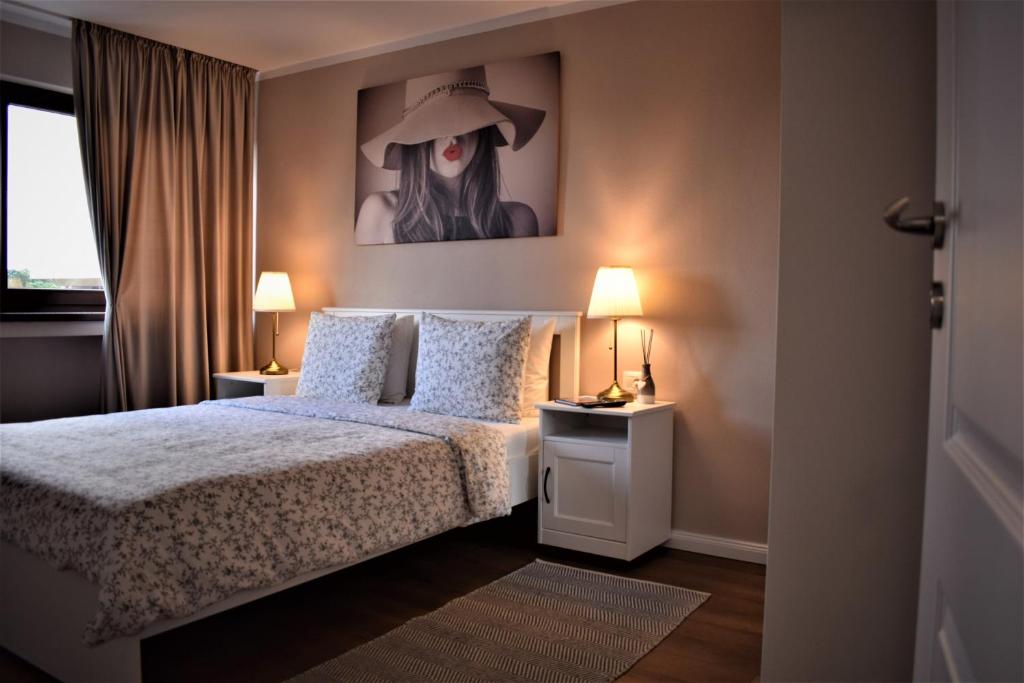 Ліжко або ліжка в номері Apartament ALBA CAROLINA