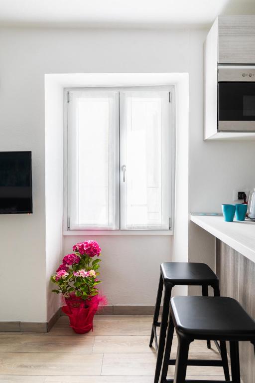 TV a/nebo společenská místnost v ubytování La Terrazza sul Lago di Como con garage