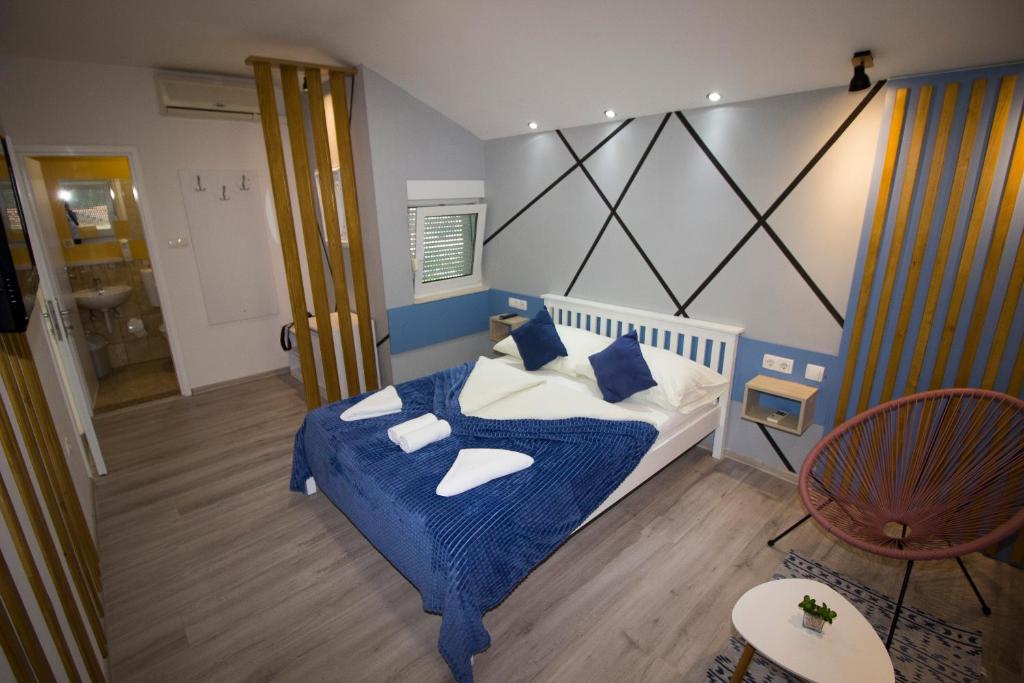 Postel nebo postele na pokoji v ubytování Hotel Villa Nadin