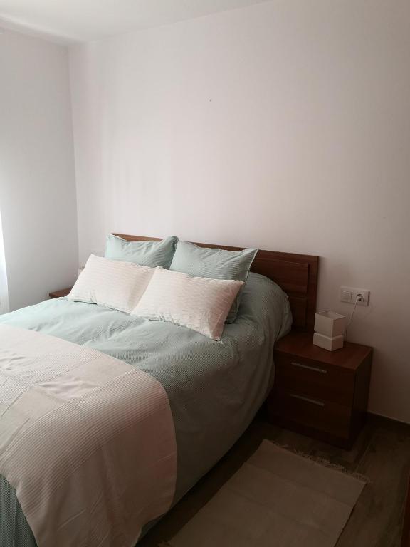 Postel nebo postele na pokoji v ubytování Apartamentos en casa Portonovo vacaciones