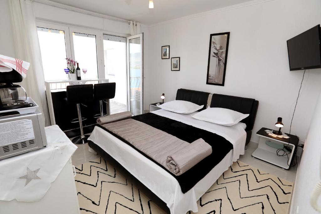 Posteľ alebo postele v izbe v ubytovaní Apartments ITD