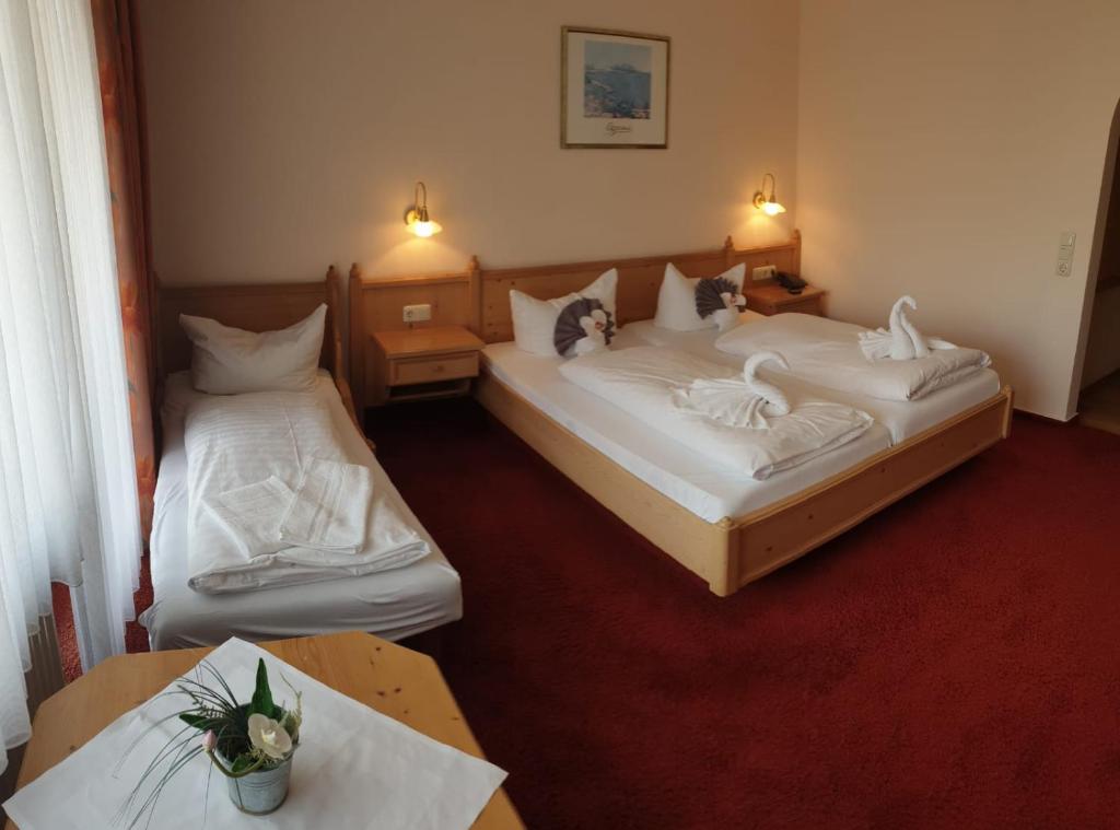 Postel nebo postele na pokoji v ubytování Hotel Igelstadt