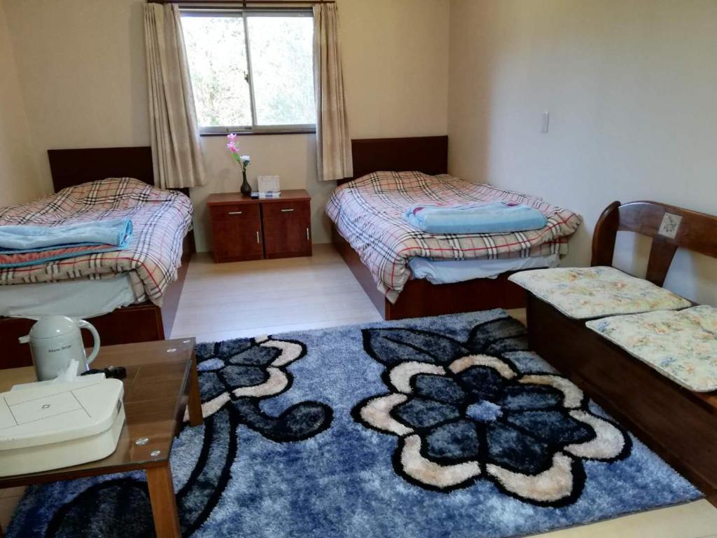 Postel nebo postele na pokoji v ubytování Hotel Otani