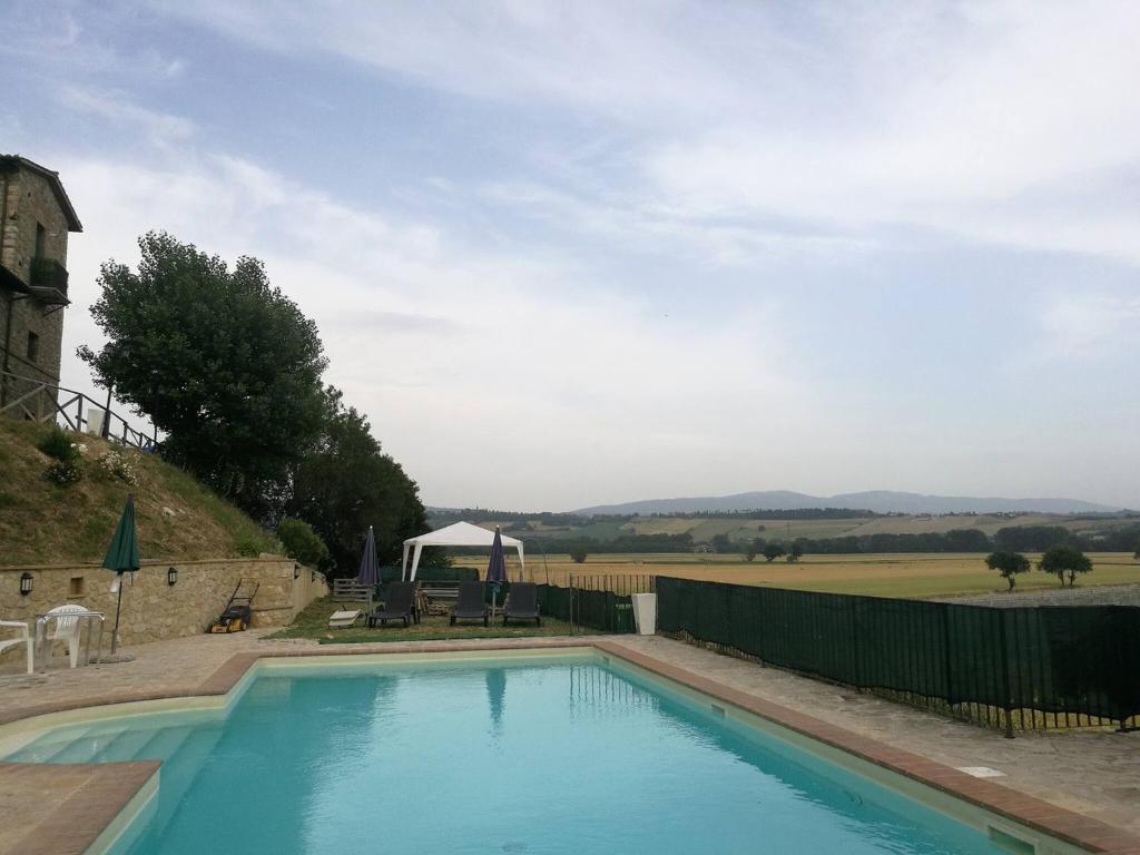 Kép Camera Matrimonialedoppia Con Balcone Vista Piscina szállásáról Monte Molinóban a galériában